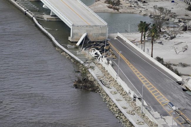 1000-2 an aerial view of a bridge over a body of water